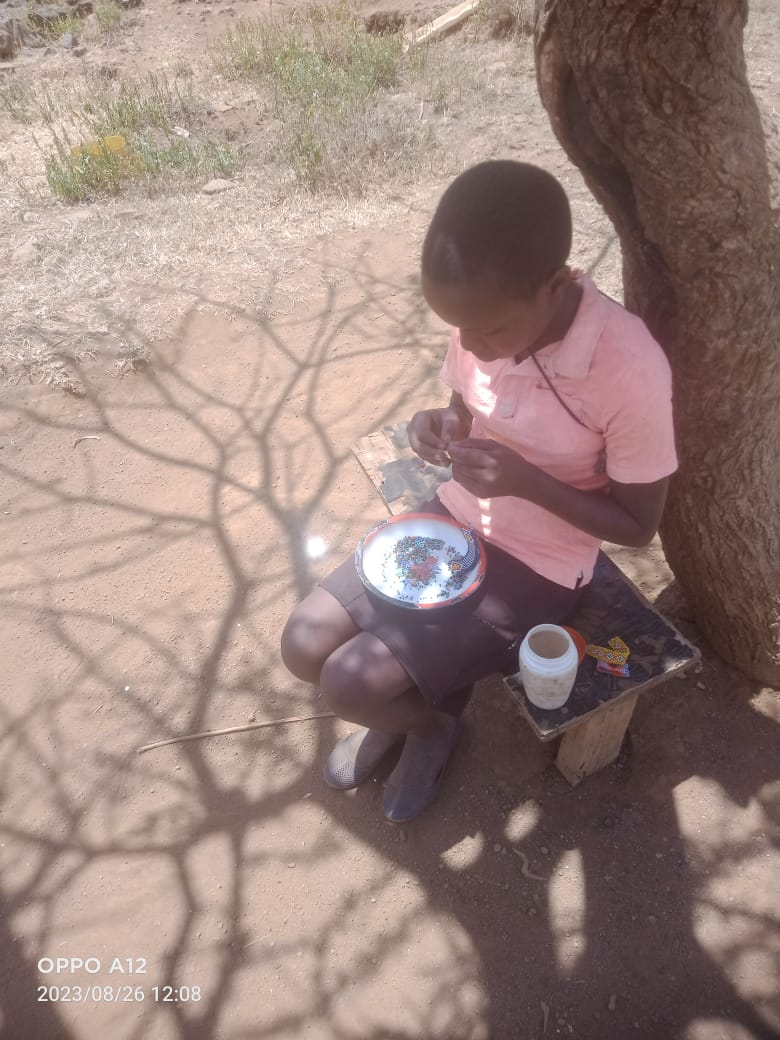 Empowering a young girl through bead work